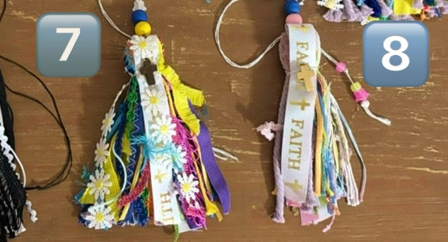 Decorative ribbons with tassels on a wooden surface, numbered 7 and 8.