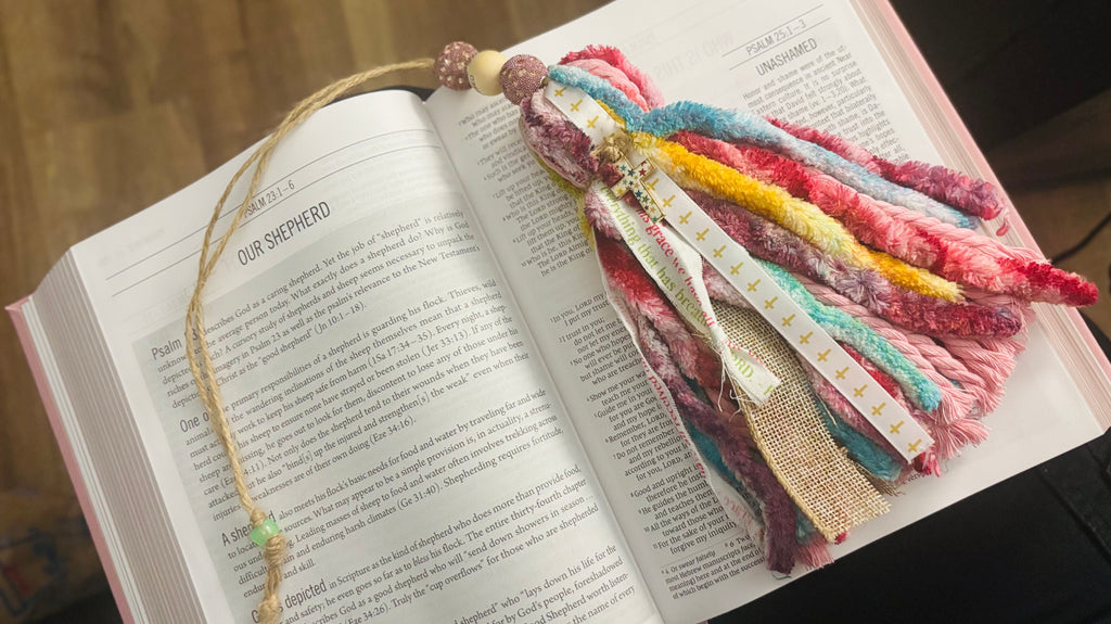 Colorful braided bookmark on an open book