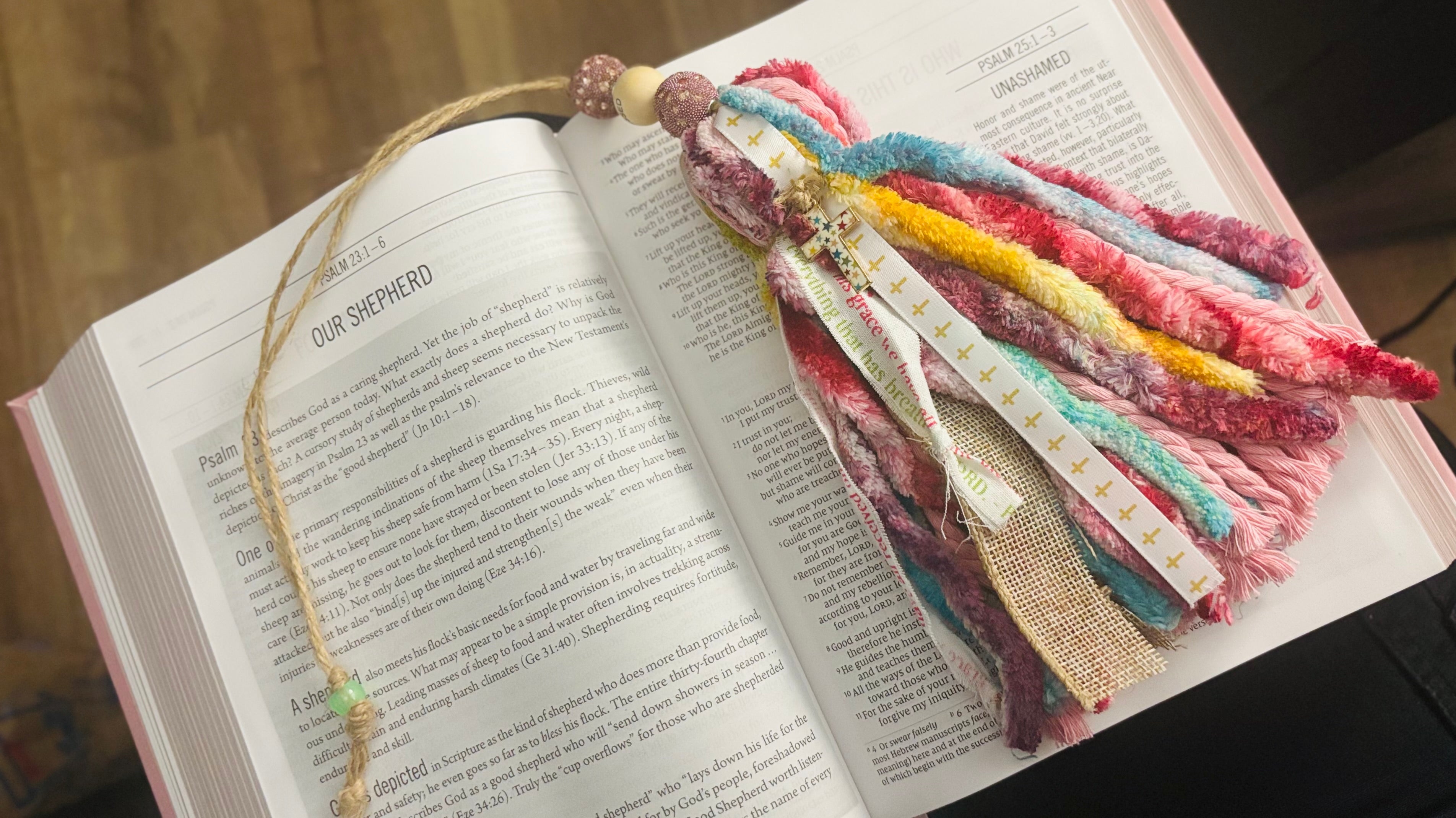 Colorful braided bookmark on an open book