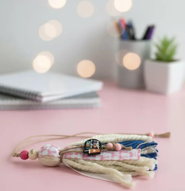 pink and beige themed bible bookmark, with charm about coffee. Love wooden bead, with blue yarn and bow ribbon